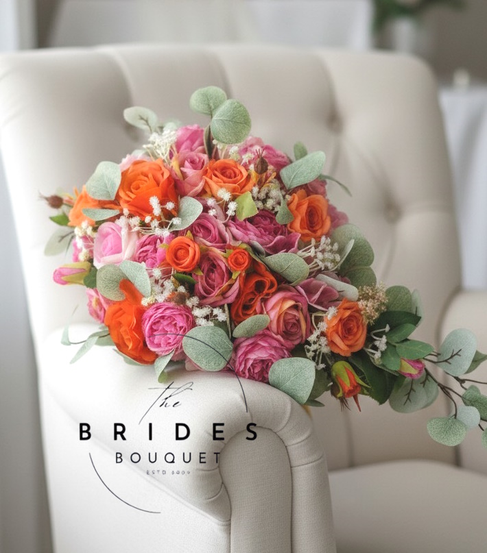 bridal tear bouquet of artificial roange and hot pink silk flowers florists choice uk bridal tear cascade bouquet of bright flowers artificial wedding bouquets brides flowers for weddings orange hot pink florist choice