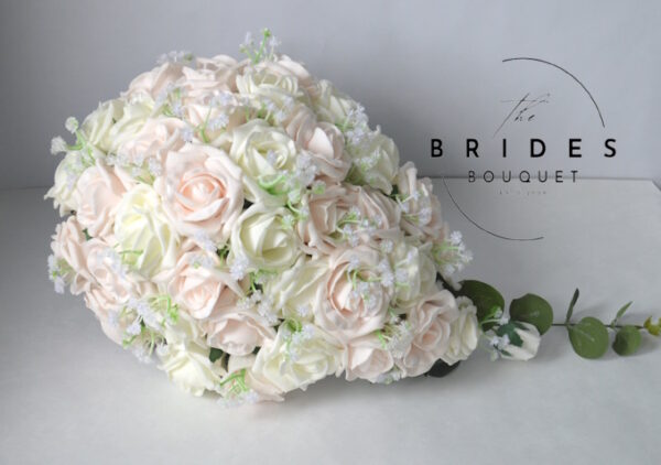 Wedding teardrop bouquet made from silk roses and baby’s breath