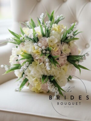 Artificial bridal bouquet with ivory and blush roses, lemon hydrangea and lily of the valley