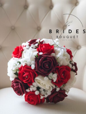 Artificial rose and gypsophila bridesmaid bouquet in burgundy, white glitter and red roses
