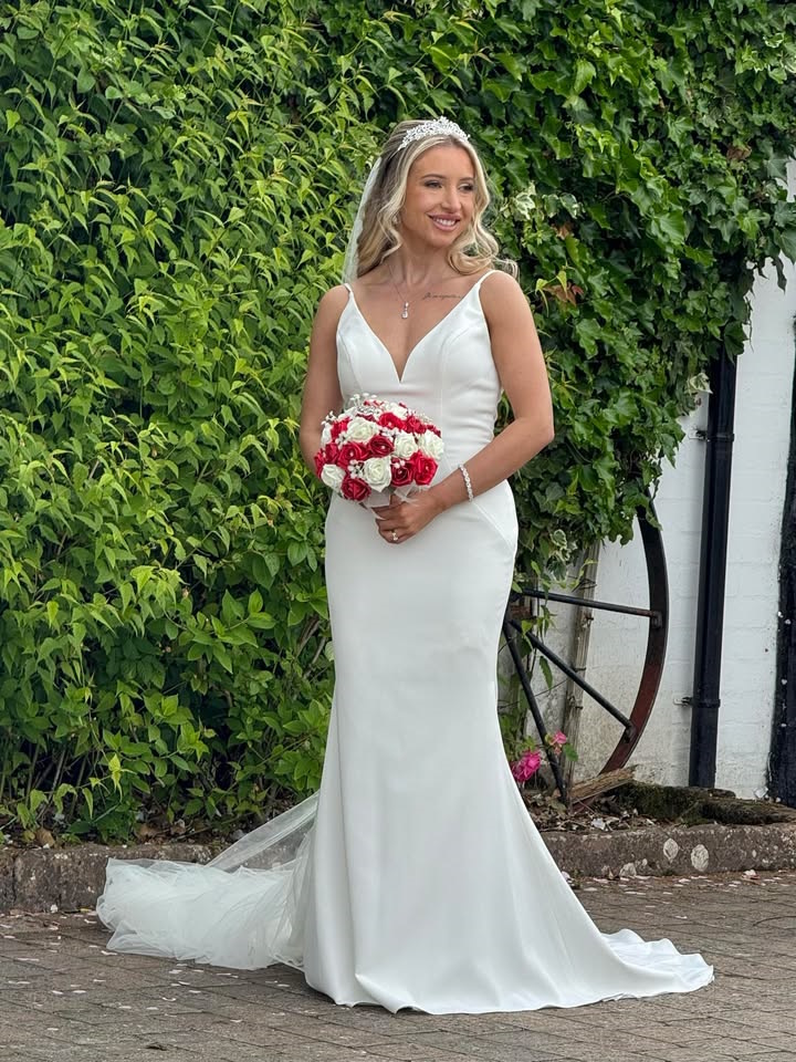 bride with red and burgundy artificial wedding flowers created by the brides bouquet uk