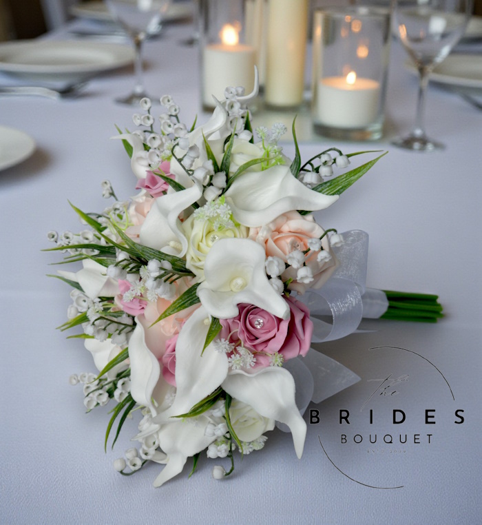 brides posy style bouquet of fake roses calla lily lily of the valley in dusky pink tones rose wedding flowers artificial