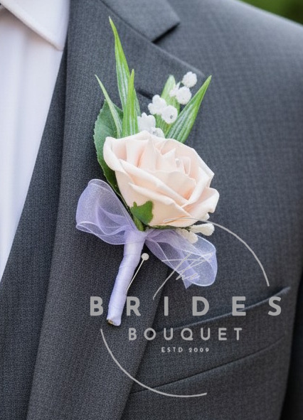 grooms rose wedding buttonhole with lily of the valley and gypsophila wedding flowers uk