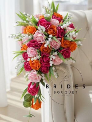 hot pink and orange wedding bouquet teardrop style