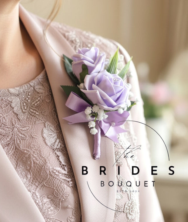 mother of the bride wedding corsage rose and lily of the valley