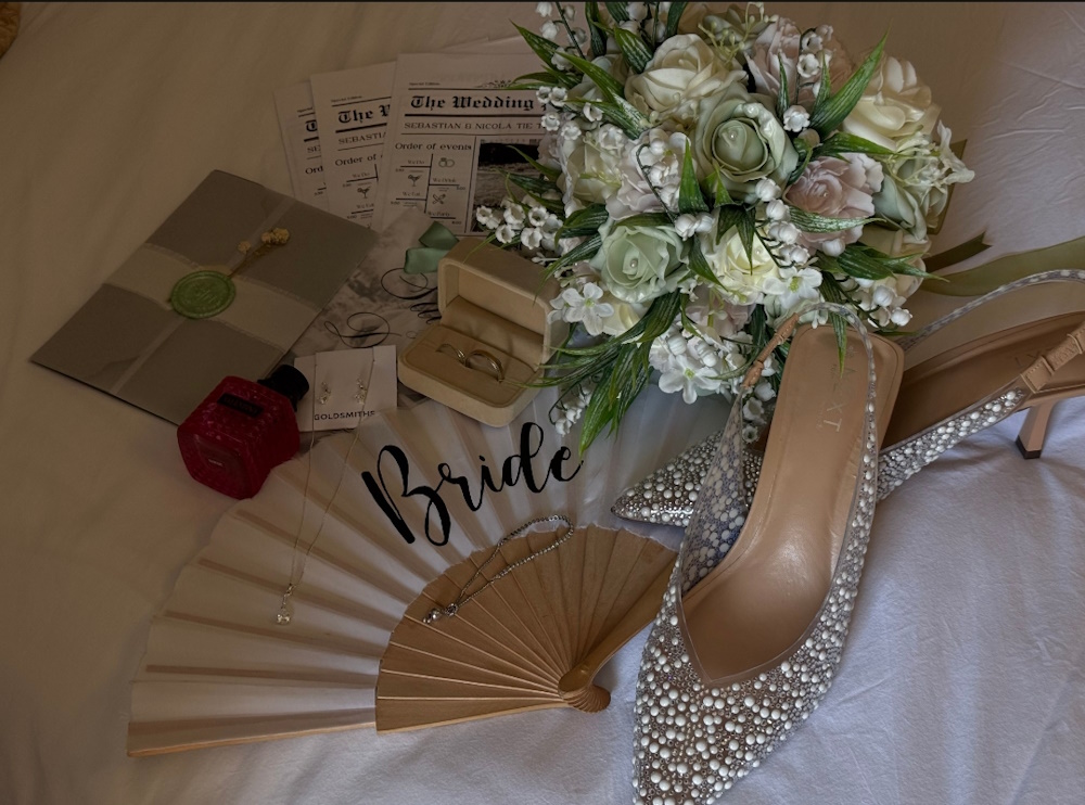 real life wedding photo from Nicola wedding day featuring bridal bouquet of artificial roses and lily of valley