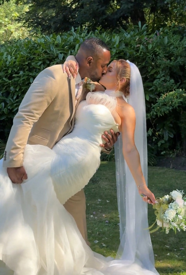 stunning real life bride and groom with summer wedding flowers created by the brides bouquet uk danielle