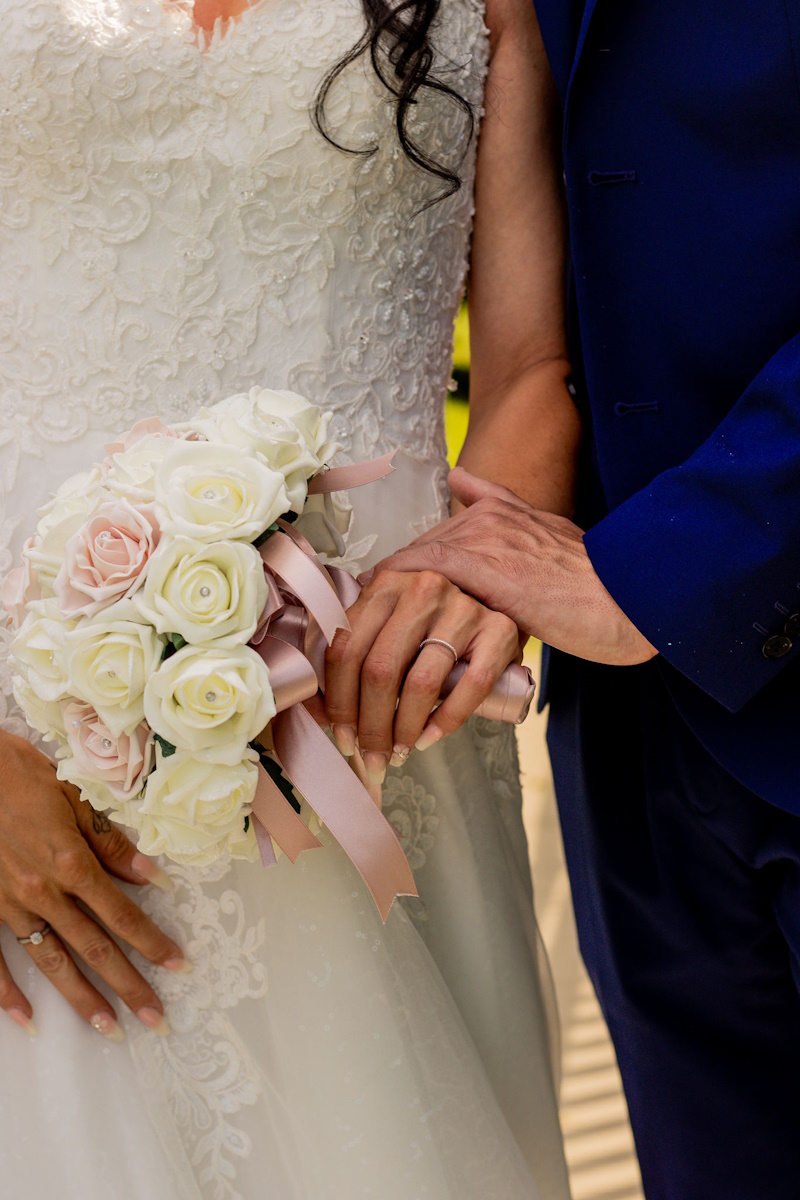 real life wedding flower photo rose gold and ivory brides rose posy
