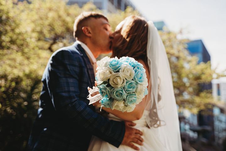 sian worth real life bride with aqua and ivory bouquet created by the brdes bouquet uk