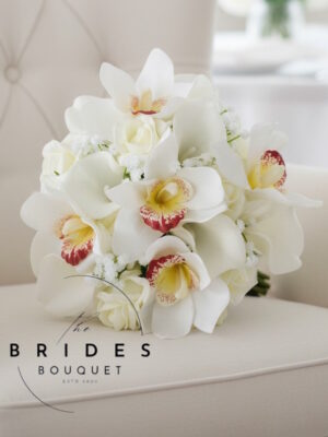 Ivory orchid bridesmaid bouquet with cymbidium orchids roses and calla lilies handmade to order