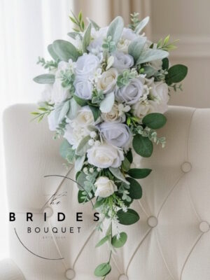 White silk rose teardrop bridal bouquet with natural look foliage