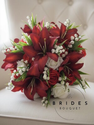 Artificial wedding bouquets with tiger lilies, roses and lily of the valley