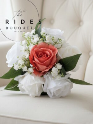 Silk rose and gypsophila flower girl posy with dark green foliage