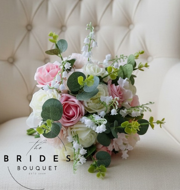 artifciial rose wedding bouquet with pink roses and lily of the valley with foliage eucalyptus