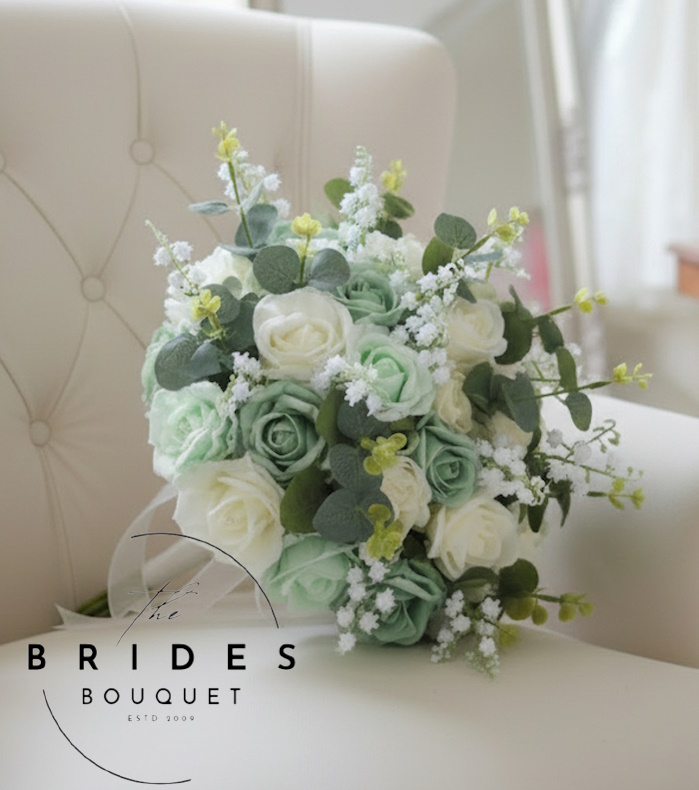 green and ivory rose wedding bouquet with roses lily of the valley and eucalyptus