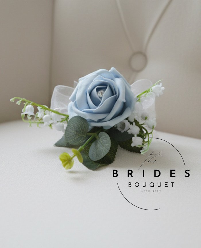 grooms rose buttonhole rose and lily of the valley with eucalyptus