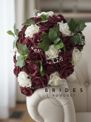 Small cascade wedding bouquet with artificial roses, ivy foliage and pearls in personalised colours