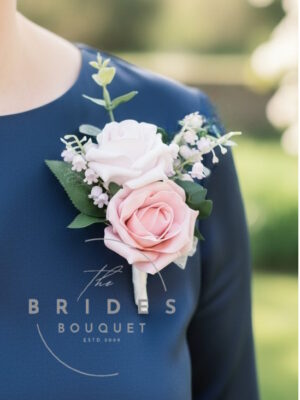 mother of the bride artificial rose wedding buttonhole with lily of the valley