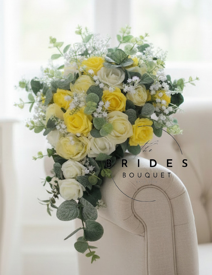 bridal tear bouquet of beautiful artificial roses with lily of the valley and eucalyptus