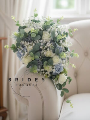 Teardrop wedding bouquet of faux roses, lily of the valley and eucalyptus
