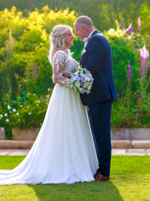 lilac rose wedding bouquet with lily of the valley shown with real life bride and groom