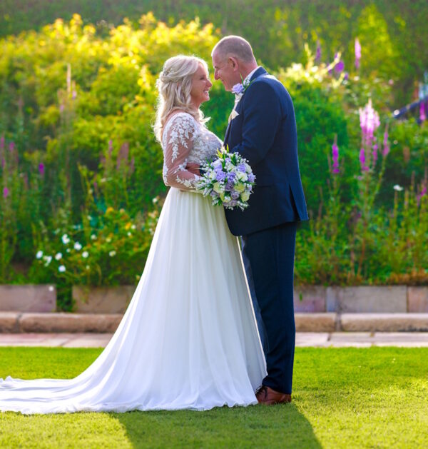 lilac rose wedding bouquet with lily of the valley shown with real life bride and groom