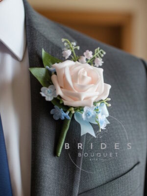 spring wedding buttonhole artificial rose forget me not and lily valley