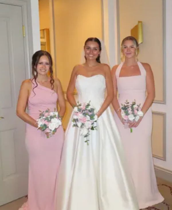 beautiful real life bride lucy with pink wedding flowers created by the brides bouquet uk