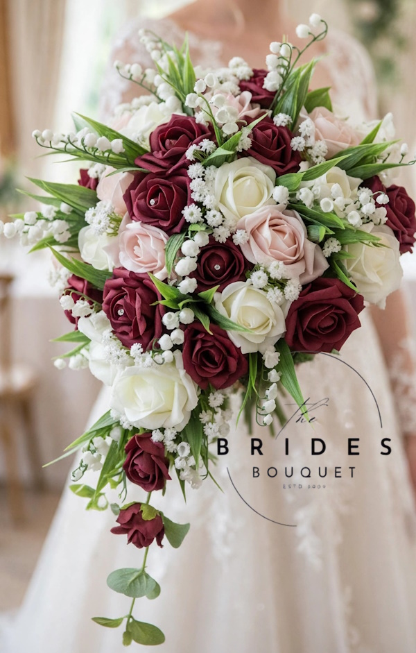 bridal tear bouquet of burgundy and rose gold faux roses with lily olf the valley