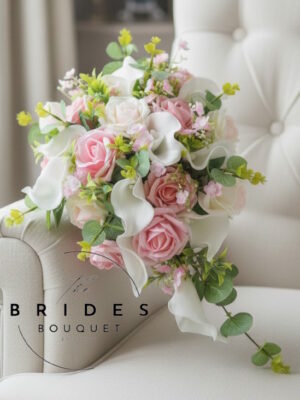 small artificial bridal bouquet with roses and calla lilies