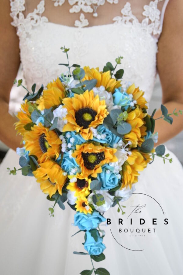 artificial bridal bouquet featuring large silk sunflowers, delicate gypsophila, lush eucalyptus, and customizable rose colors, arranged in a cascading teardrop shape