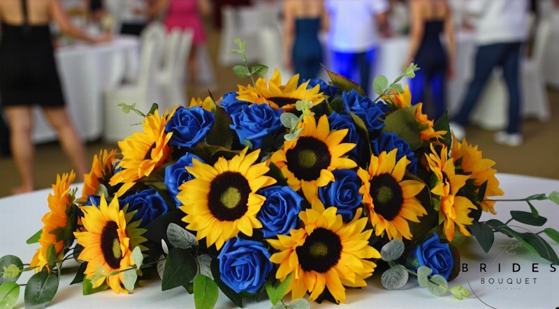 artificial sunflower and rose top table arrangements of flowers for weddings and events'
