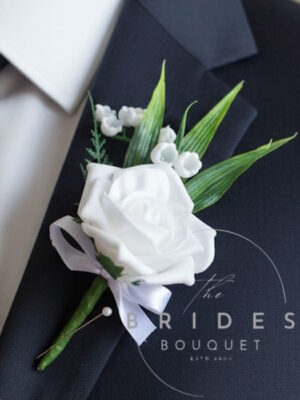 white rose wedding buttonhole with lily of the valley