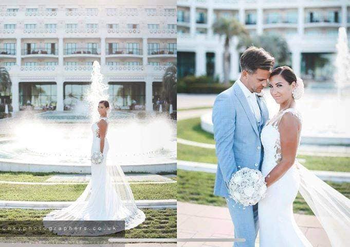 bride and groom with flowers created by the brides bouquet uk sillver grey bridal flowers