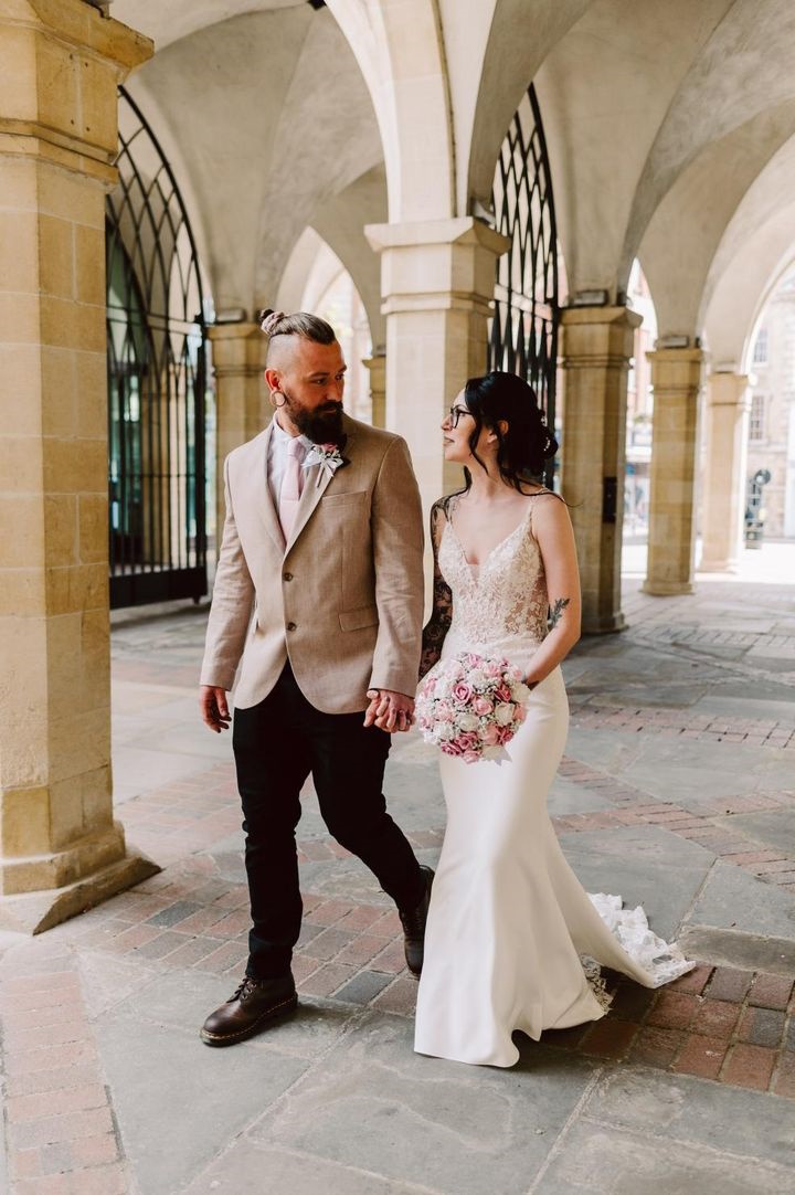 bride groom with pink bridal bouquet lots of gyp by the brides bouquet uk