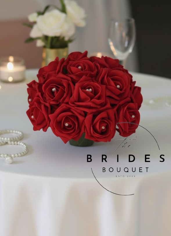 guest table artificial flower arrangement of roses all colours wedding flowers venue styling