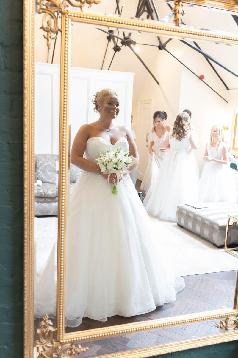 bride and bridesmaids with artificial white wedding flowers created by the brides bouquet uk real life weddings
