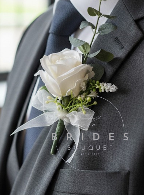 silk rose wedding buttonhole with eucalyptus astilbe and foliage
