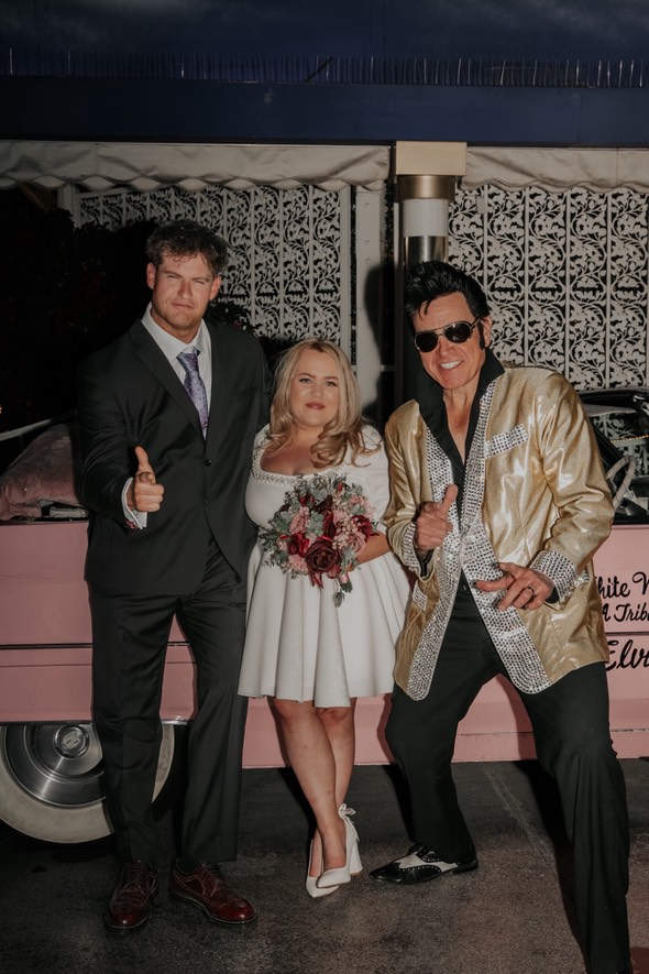 bride gemma with her wedding flowers in vegas with elvis and her husband