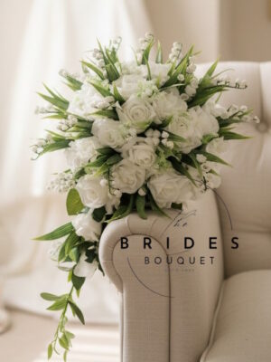 White rose teardrop bridal bouquet with lily of the valley and gypsophila handmade to order artificial wedding flowers.