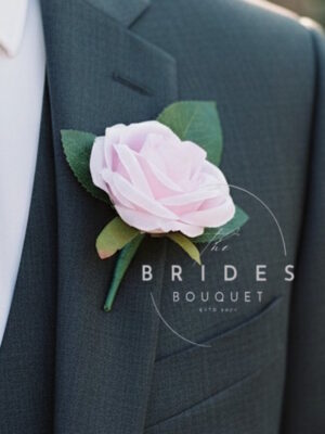 baby pink silk rose wedding buttonhole for guests