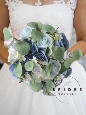 Dusky blue wedding bouquet with ivory roses and eucalyptus