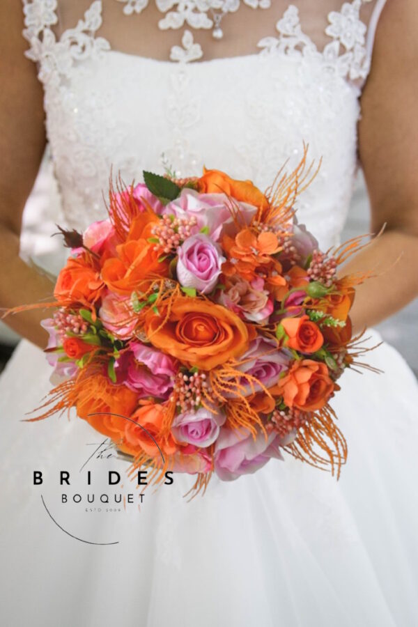 Vibrant artificial wedding bouquet in pink and orange shades