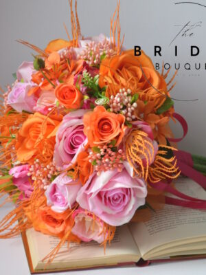 Orange and pink silk bridal bouquet with matching buttonholes