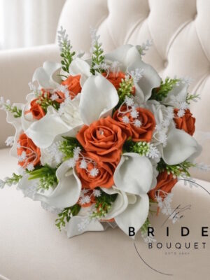 Artificial wedding bouquet with orange and white roses, calla lilies, gypsophila, and astilbe