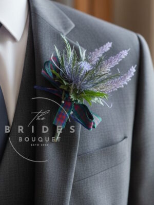 Scottish thistle and lilac heather wedding buttonhole with tartan ribbon