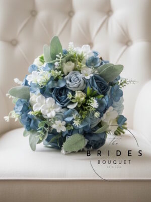 Natural look dusty blue silk wedding bouquet with roses, hydrangeas, and greenery