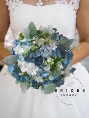 Natural look dusty blue silk wedding bouquet with roses, hydrangeas, and greenery