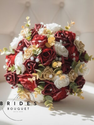 artificial bridal bouquet of russet and gold silk flowers for autumn winter wedding
