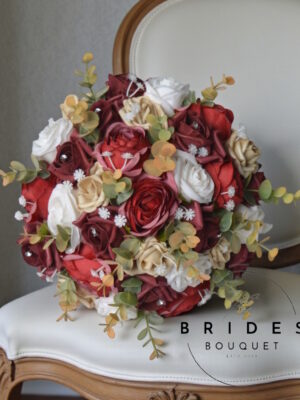 artificial bridal bouquet of russet and gold silk flowers for autumn winter wedding